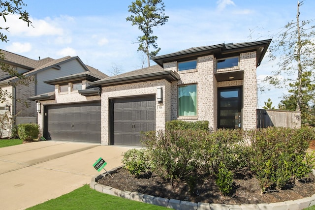 prairie-style house featuring a garage