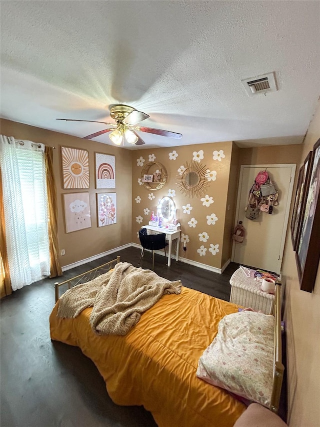 bedroom with a textured ceiling and ceiling fan