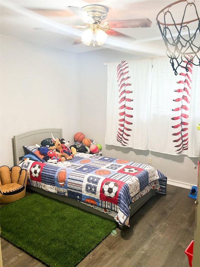 bedroom featuring ceiling fan and hardwood / wood-style flooring