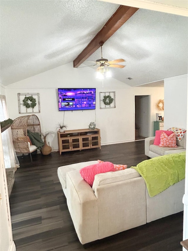 living room featuring ceiling fan, vaulted ceiling with beams, dark hardwood / wood-style floors, and a textured ceiling