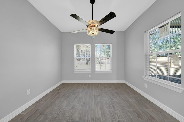 empty room featuring ceiling fan and wood-type flooring