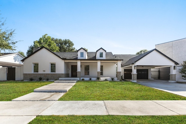 view of front of property with a front yard, a garage, a porch, and a carport