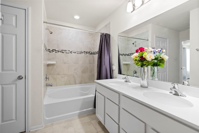 bathroom featuring tile patterned flooring, shower / bathtub combination with curtain, and vanity