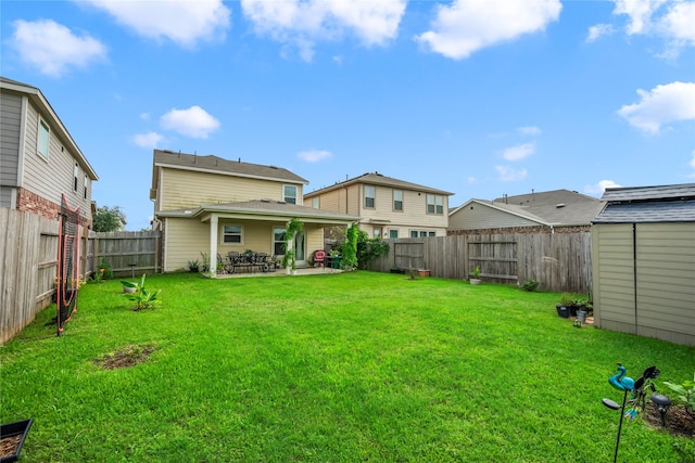 view of yard with a patio area and a shed