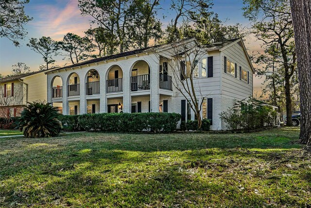 view of front of home with a lawn