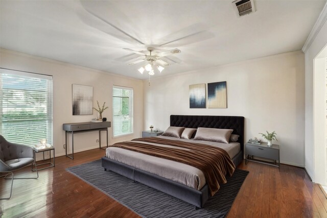 bedroom with dark wood-type flooring, ceiling fan, and multiple windows