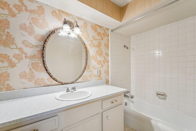 bathroom with vanity and tiled shower / bath combo