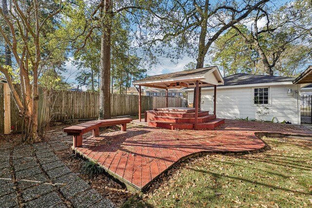 view of patio / terrace featuring a jacuzzi and a deck