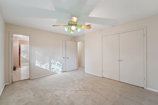 unfurnished bedroom with light carpet, baseboards, visible vents, and a ceiling fan