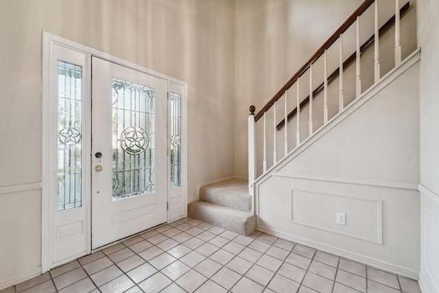 entrance foyer with light tile patterned floors