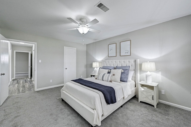 bedroom with ceiling fan and carpet