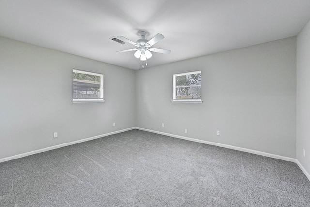 unfurnished room featuring carpet floors and ceiling fan