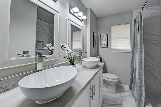 bathroom featuring toilet, a shower with curtain, and vanity