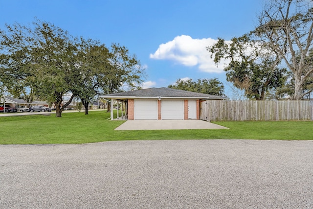 garage featuring a yard