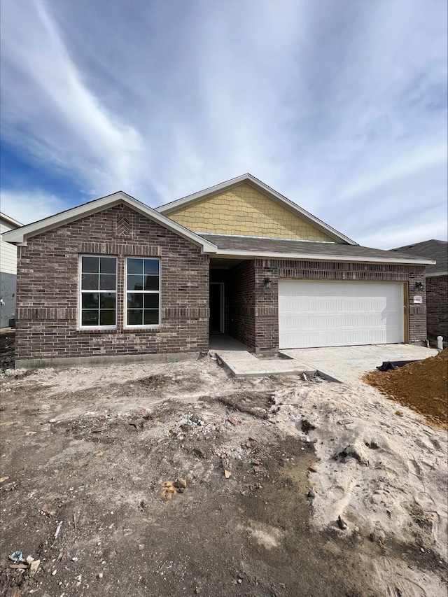 single story home with a garage