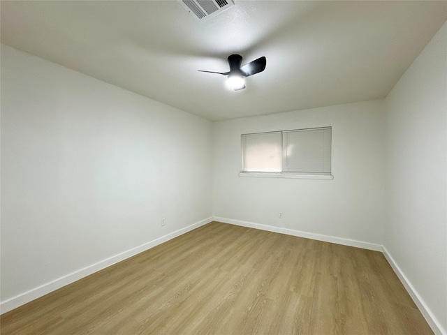 empty room with light hardwood / wood-style flooring