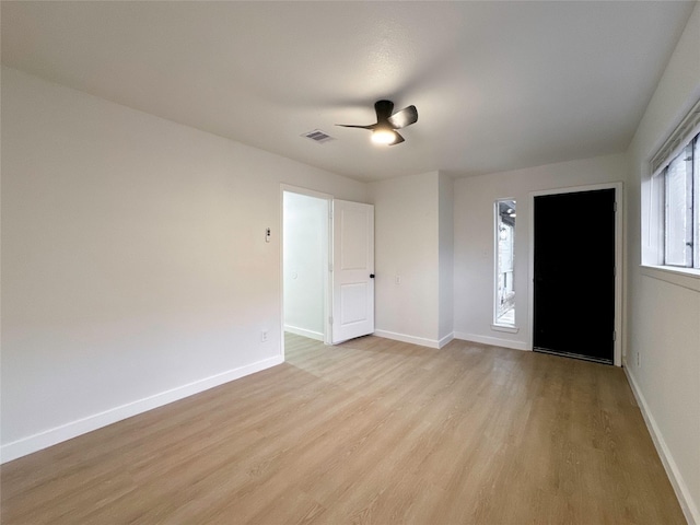 spare room featuring ceiling fan and light wood-type flooring