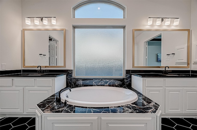 bathroom with vanity and a bathtub