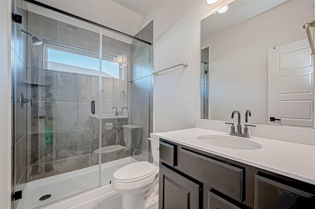 bathroom featuring toilet, vanity, an enclosed shower, and tile patterned flooring