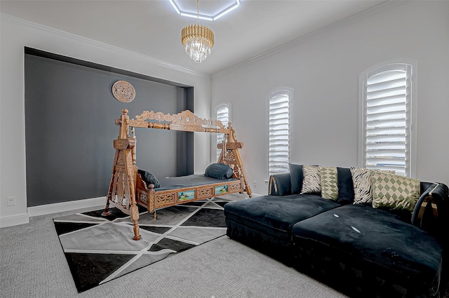 living room featuring carpet, ornamental molding, and a chandelier