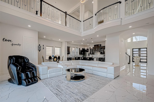 living room with a towering ceiling