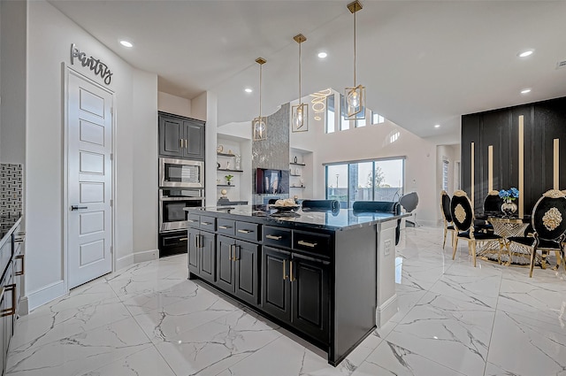 kitchen with stone counters, a center island, hanging light fixtures, a kitchen breakfast bar, and stainless steel appliances