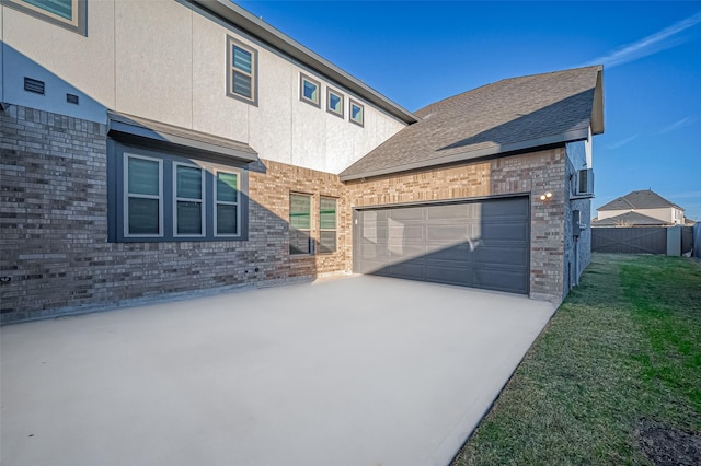 view of front of property with a front yard and a garage