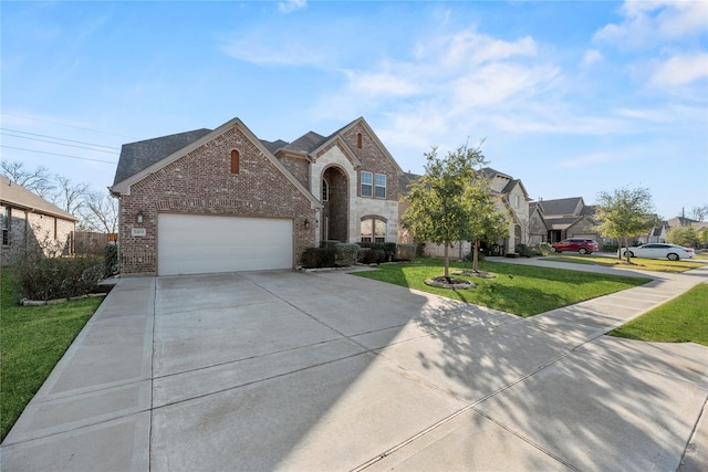 view of front of home with a garage and a front yard