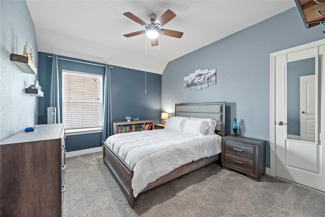 bedroom featuring ceiling fan, carpet floors, and lofted ceiling