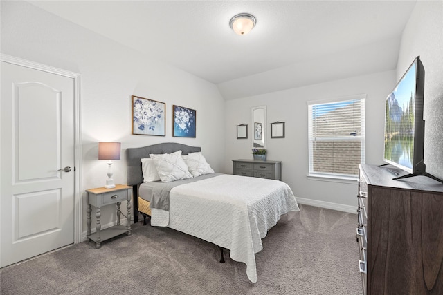 bedroom with carpet flooring and lofted ceiling