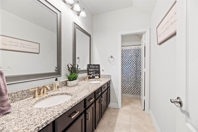 bathroom with vaulted ceiling, walk in shower, tile patterned floors, and vanity