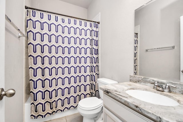 full bathroom featuring toilet, vanity, shower / bath combo, and tile patterned flooring