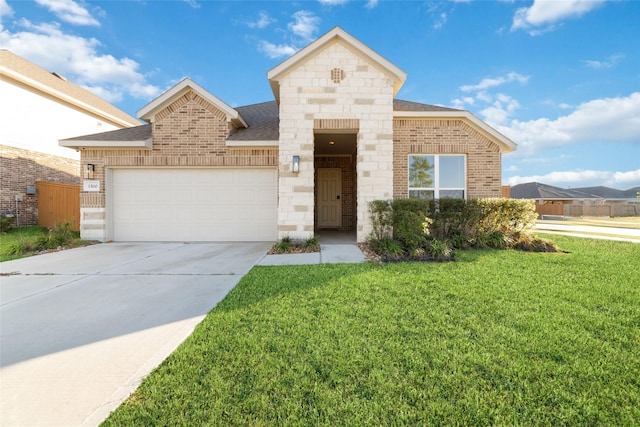 view of front of home with a front lawn and a garage