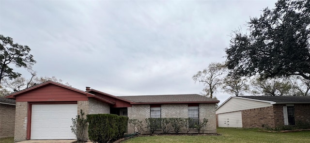 ranch-style home with a front lawn and a garage