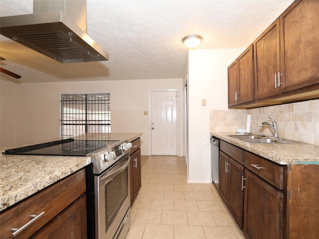 kitchen with sink, appliances with stainless steel finishes, backsplash, island range hood, and a textured ceiling