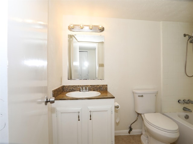 full bathroom with vanity, tile patterned floors, toilet, and tiled shower / bath