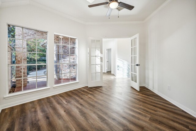 unfurnished room with ceiling fan, dark hardwood / wood-style floors, crown molding, and french doors