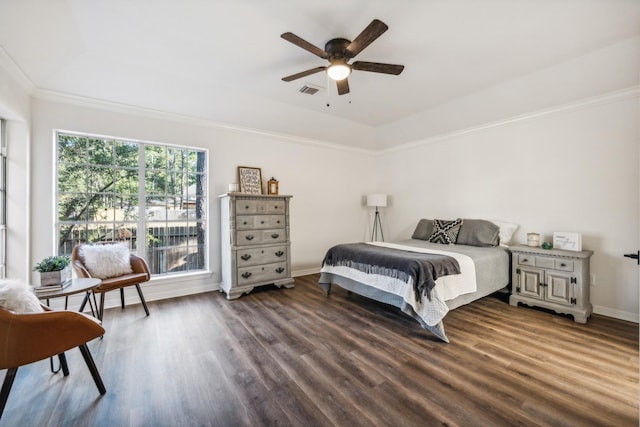 bedroom featuring ceiling fan, a raised ceiling, and dark hardwood / wood-style floors