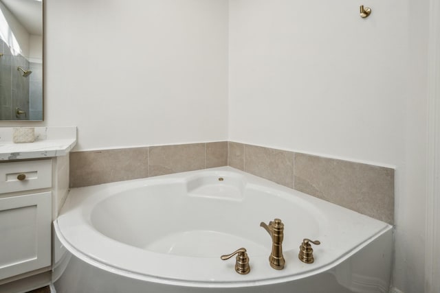 bathroom featuring a bathtub and vanity