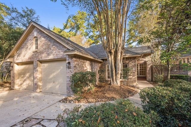 ranch-style home featuring a garage