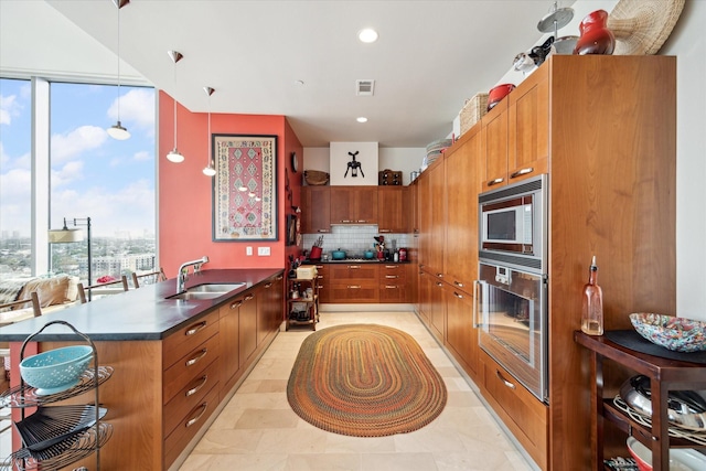 2727 Kirby Dr Unit 13C, Houston, TX 77098 - kitchen featuring decorative light fixtures, sink, decorative backsplash, and stainless steel appliances