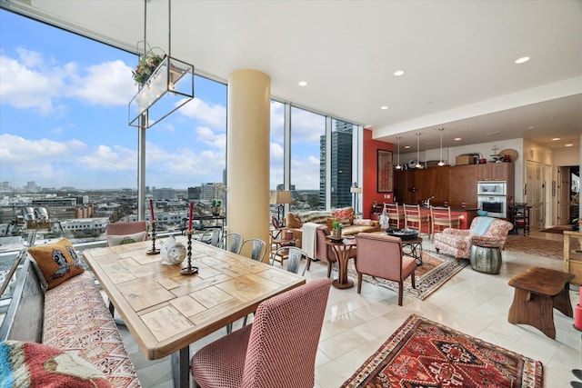 tiled dining area with floor to ceiling windows