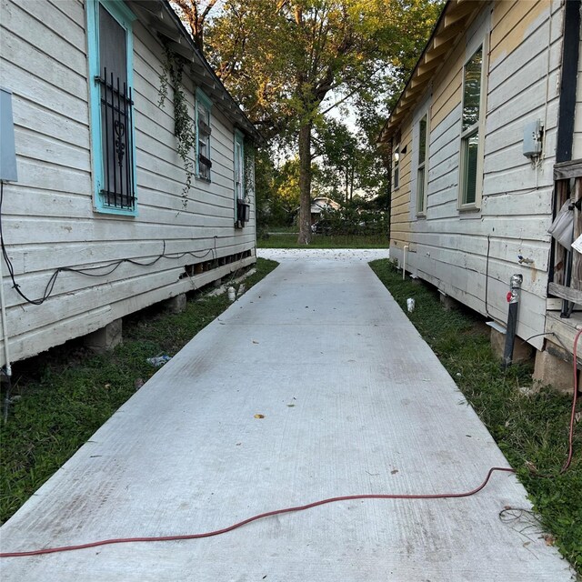 view of side of home with a patio area