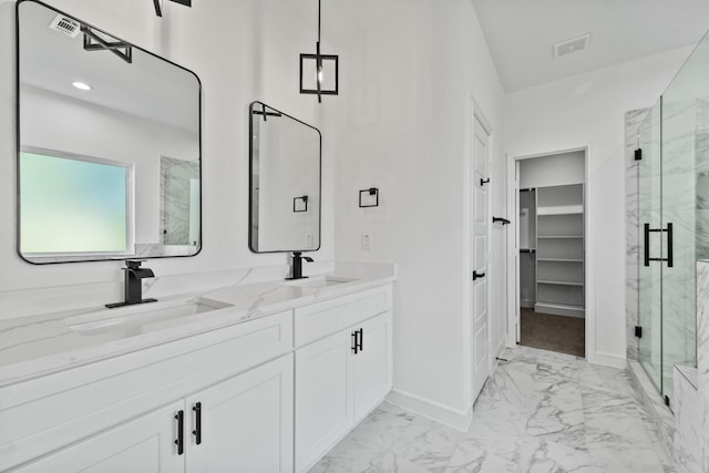 bathroom featuring walk in shower and vanity