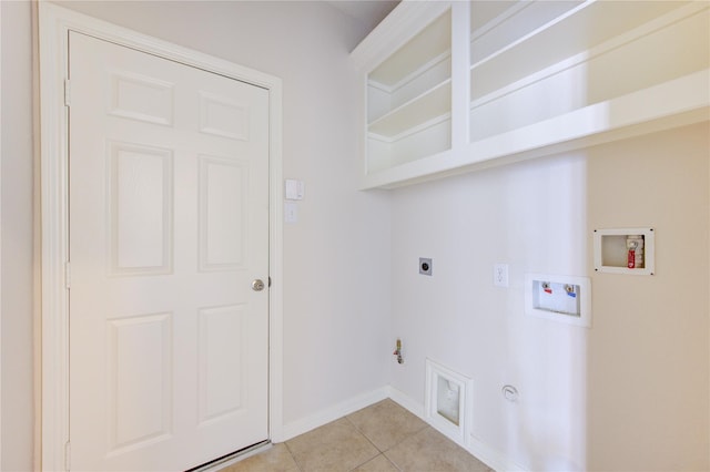 laundry room featuring light tile patterned flooring, washer hookup, hookup for an electric dryer, and hookup for a gas dryer