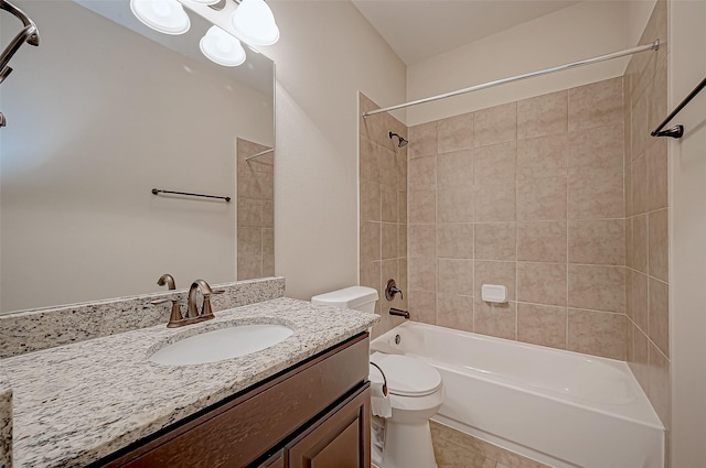 full bathroom with tiled shower / bath, vanity, toilet, and tile patterned flooring