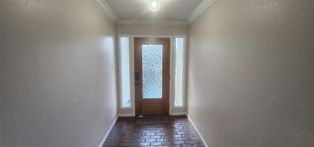 doorway with a textured ceiling and ornamental molding