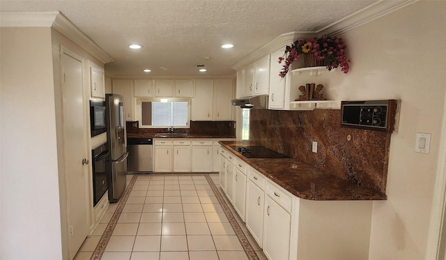 kitchen with black appliances, white cabinetry, decorative backsplash, sink, and light tile patterned floors