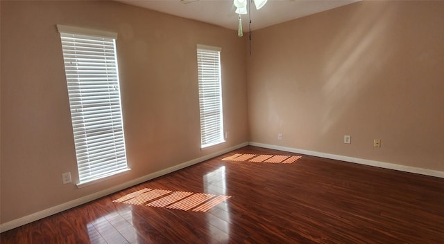 unfurnished room with ceiling fan and wood-type flooring