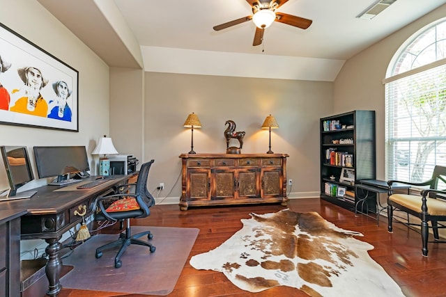 home office featuring vaulted ceiling, ceiling fan, and dark hardwood / wood-style floors